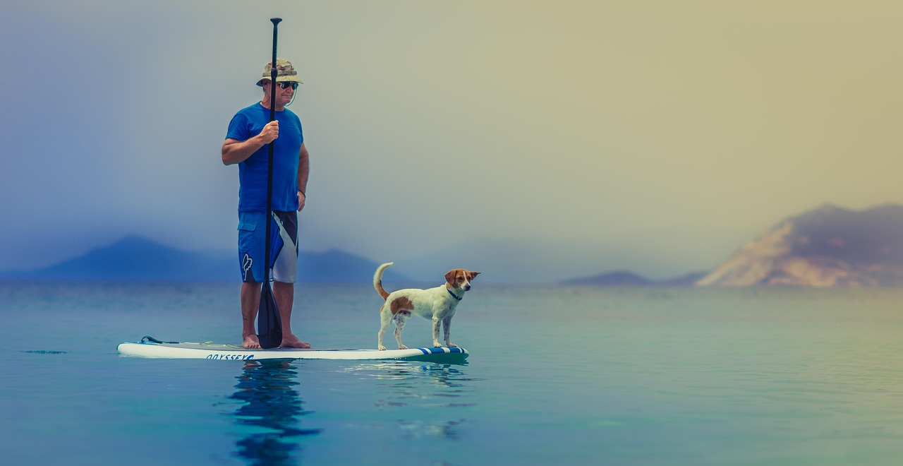 man and dog, friendship, companion, pet, owner, together, stand, standing, water, outdoors